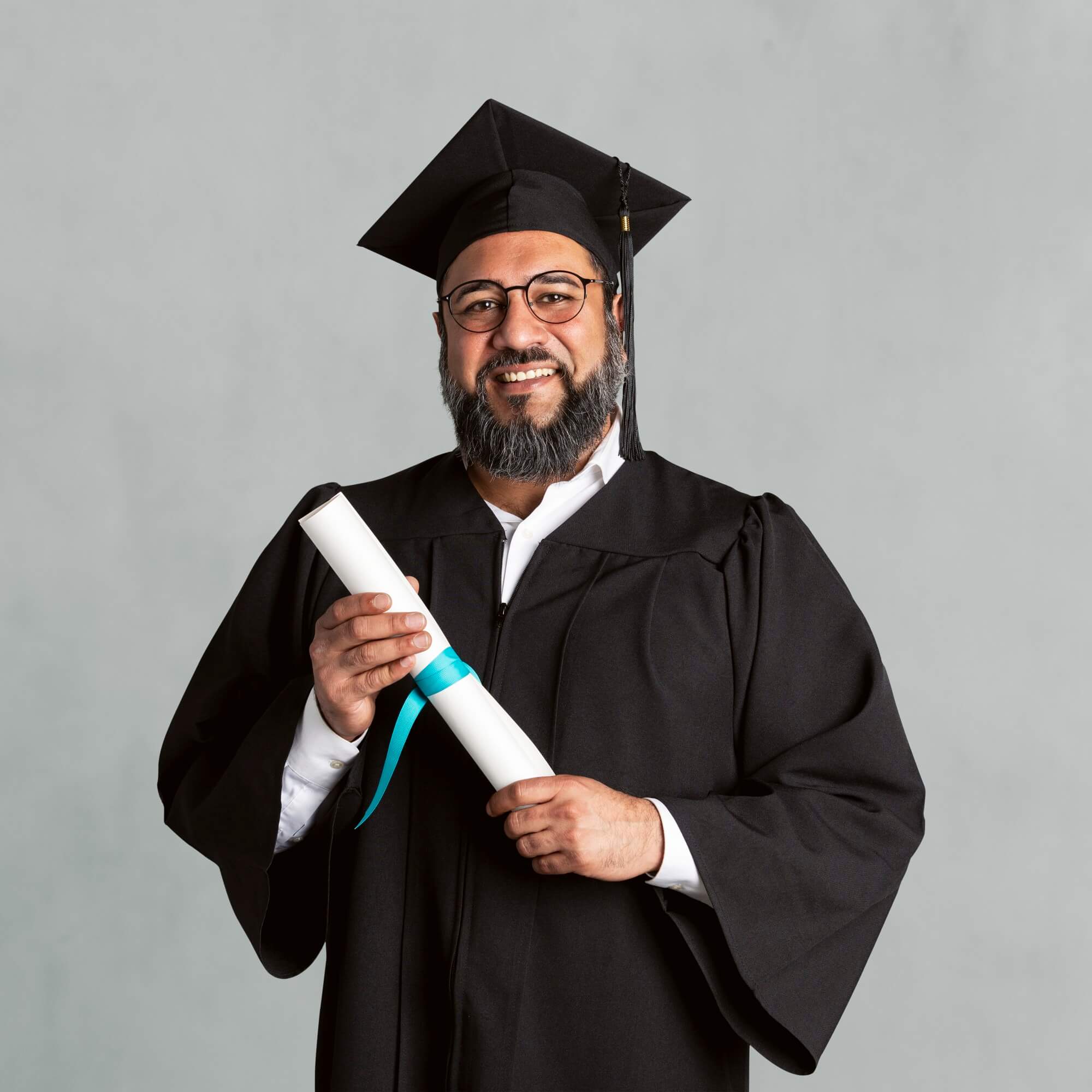 Happy Senior Man In A Graduation Gown Holding His 2025 02 10 05 26 18 Utc 1