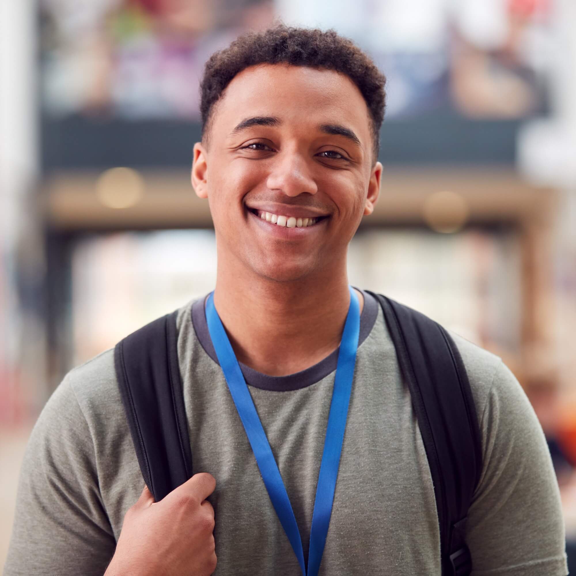 Portrait Of Smiling Male College Student In Busy C 2024 10 19 06 05 21 Utc