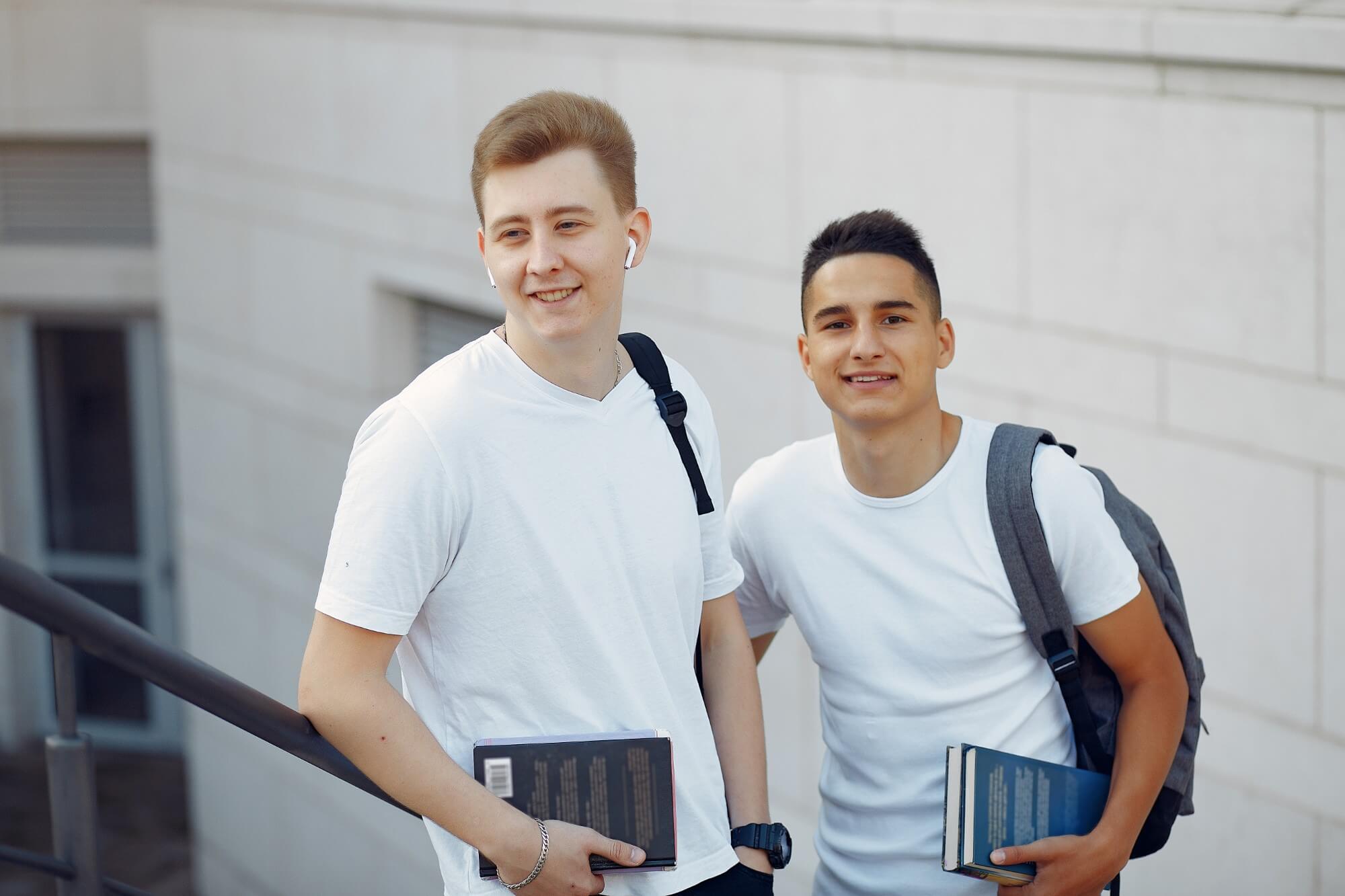 Two Students In A University Campus With A Books 2024 12 06 11 51 57 Utc